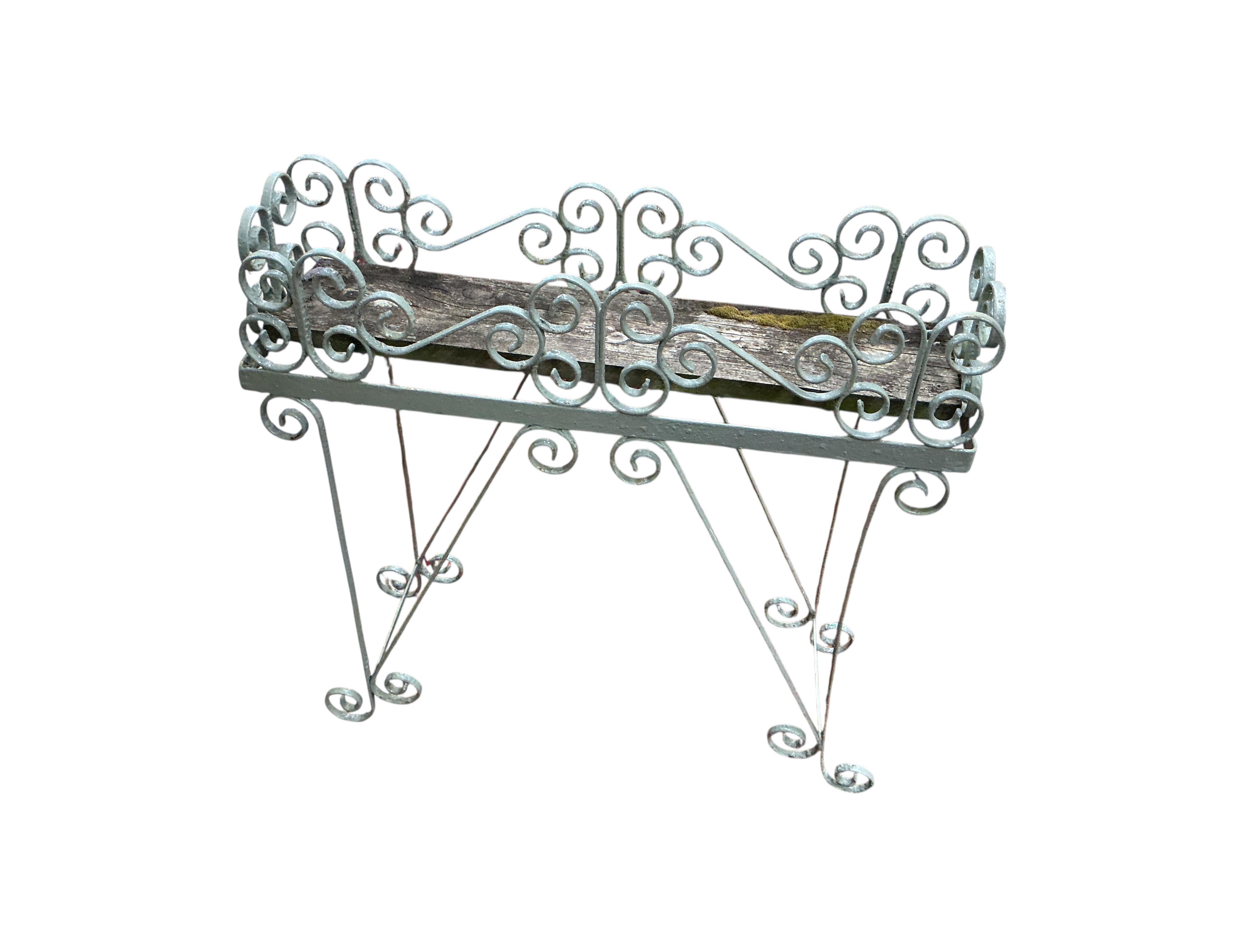 Three painted wrought pot stands, largest width 68cm, height 65cm